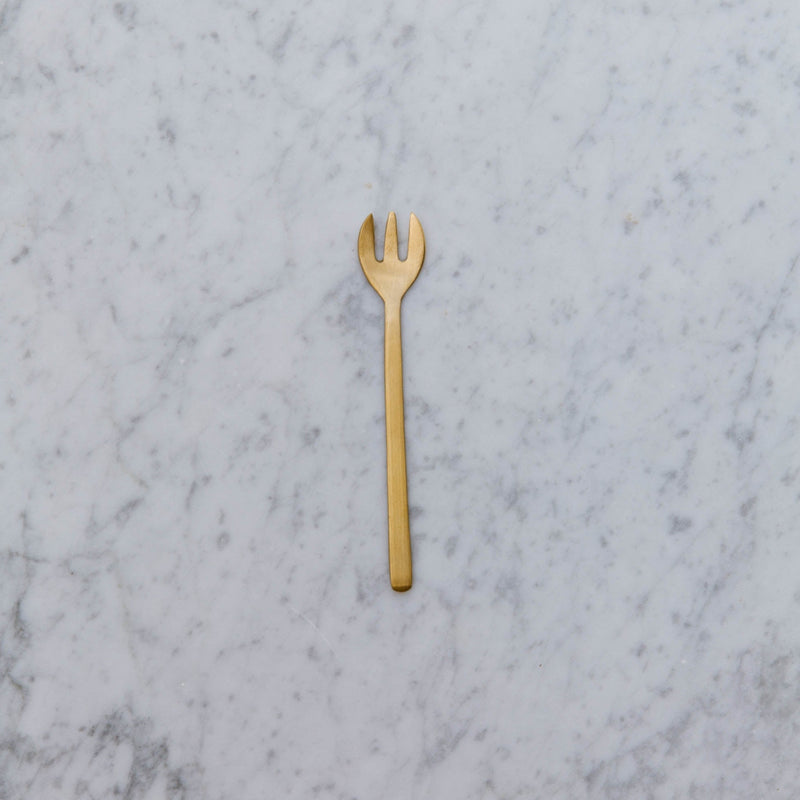small brass fork